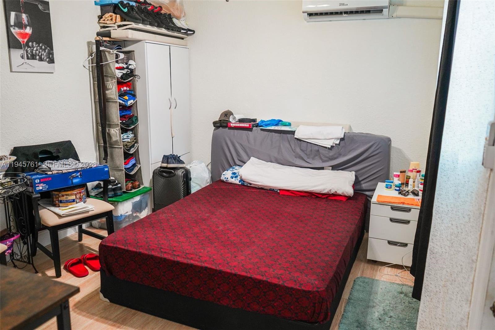 1190 West 33rd Street Hialeah, FL 33012 - Photo 37 of 54 a bedroom with a bed and a dresser in it