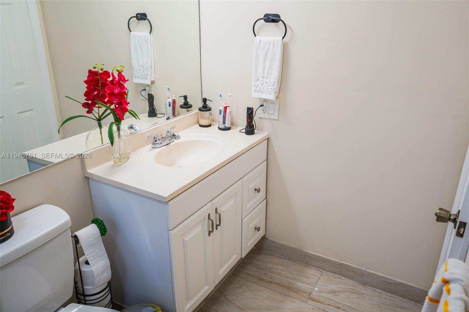 1190 West 33rd Street Hialeah, FL 33012 - Photo 39 of 54 a bathroom with a sink vanity and toilet