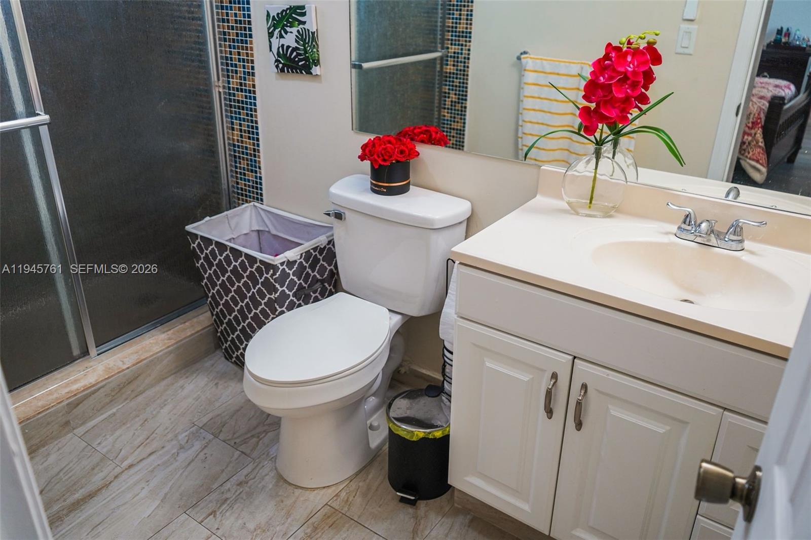 1190 West 33rd Street Hialeah, FL 33012 - Photo 40 of 54 a bathroom with a toilet sink and mirror