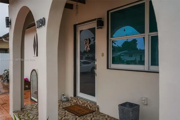 a view of entryway with wooden floor