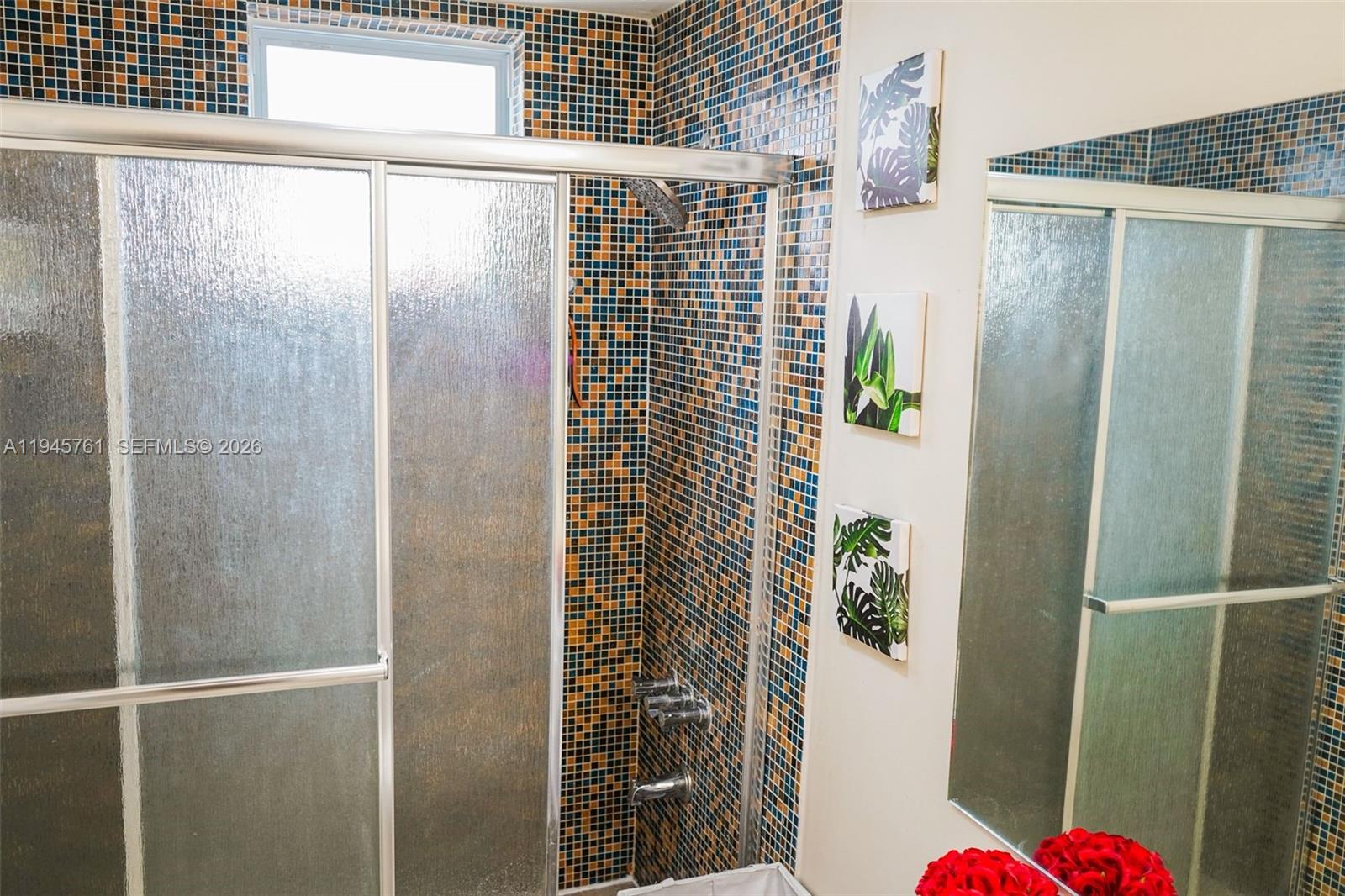 1190 West 33rd Street Hialeah, FL 33012 - Photo 41 of 54 a bathroom with a shower and a sink