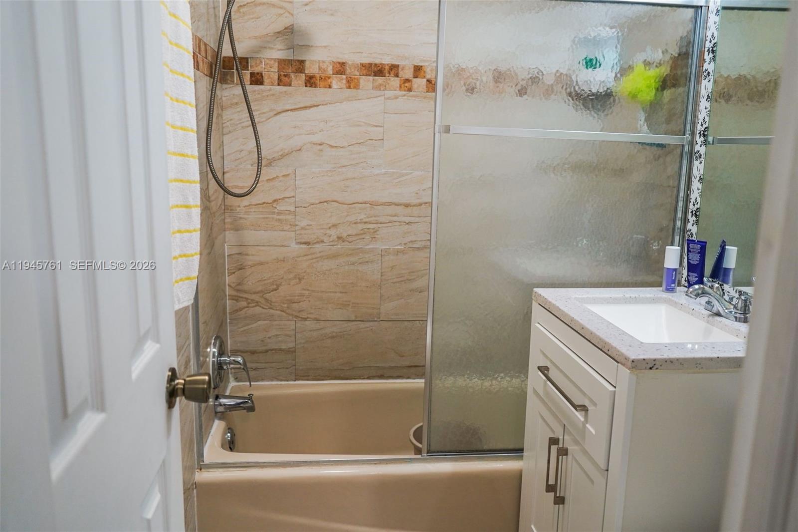 1190 West 33rd Street Hialeah, FL 33012 - Photo 44 of 54 a bathroom with a granite countertop sink and a mirror