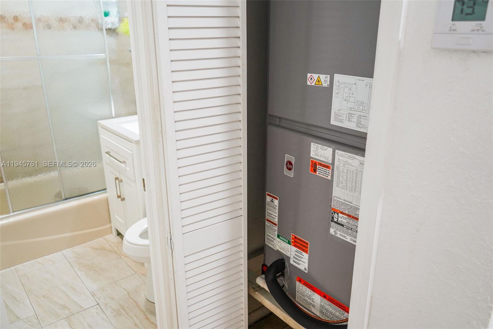 1190 West 33rd Street Hialeah, FL 33012 - Photo 46 of 54 a bathroom with a bathtub and a shower