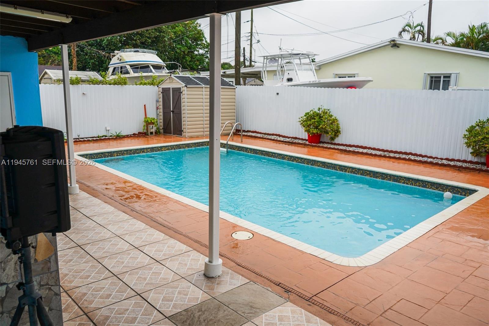 1190 West 33rd Street Hialeah, FL 33012 - Photo 48 of 54 a view of a pool with an outdoor space