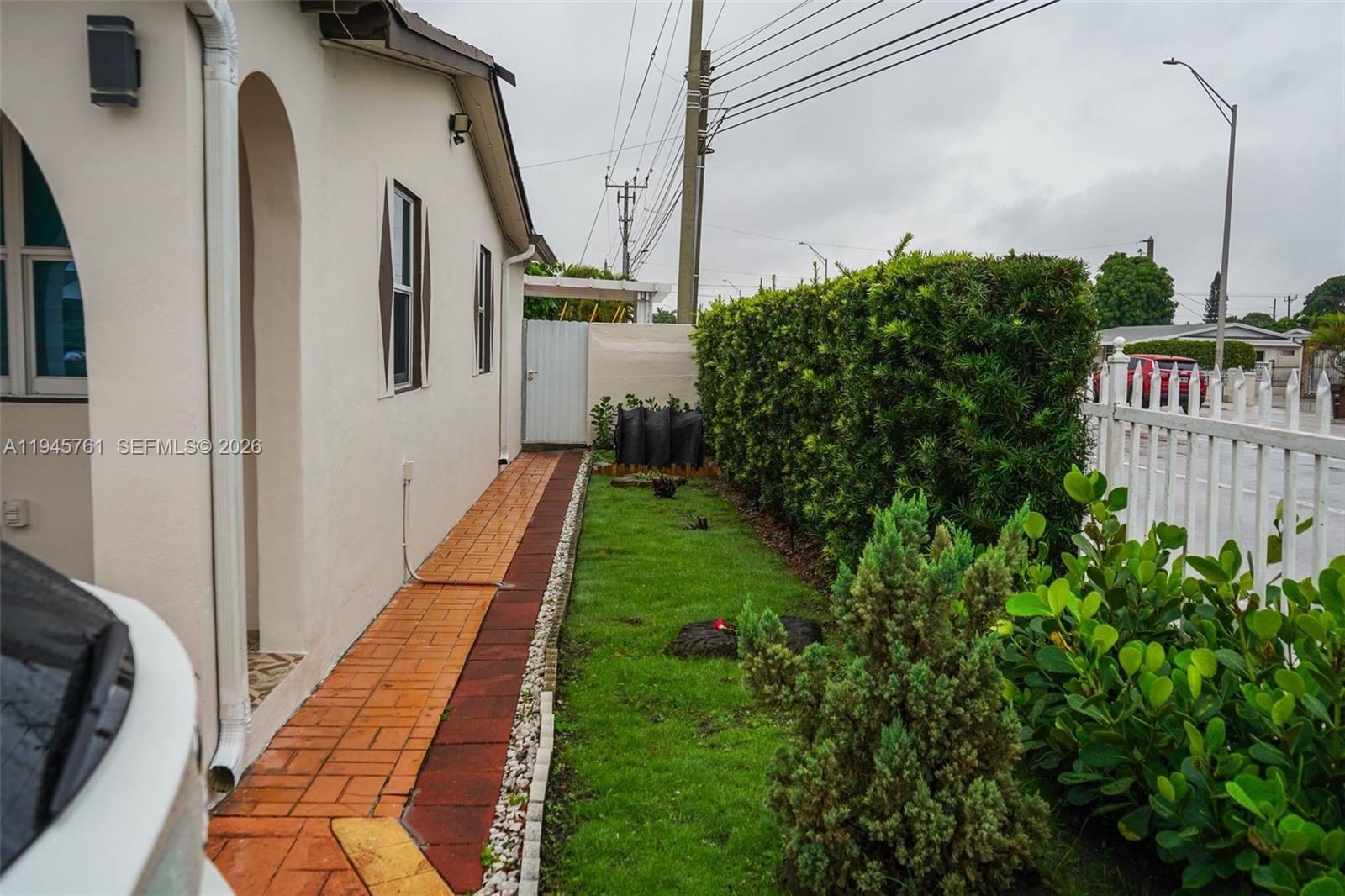 1190 West 33rd Street Hialeah, FL 33012 - Photo 7 of 54 a balcony with lots of green space
