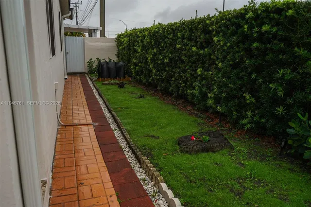 a view of a porch with wooden floor and a stairs