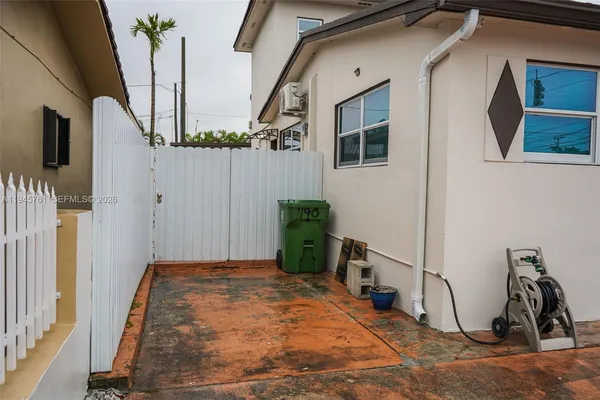 a front view of a house with parking space