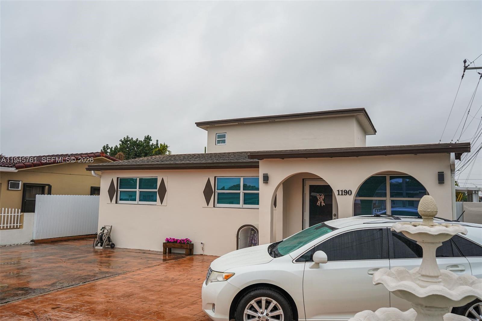 1190 West 33rd Street Hialeah, FL 33012 - Photo 10 of 54 a front view of a house with parking space