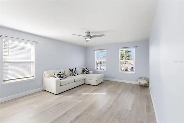 a view of a room with a dishwasher and wooden floor