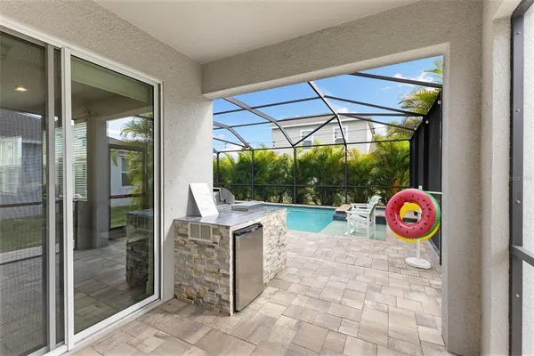 a view of swimming pool with a patio
