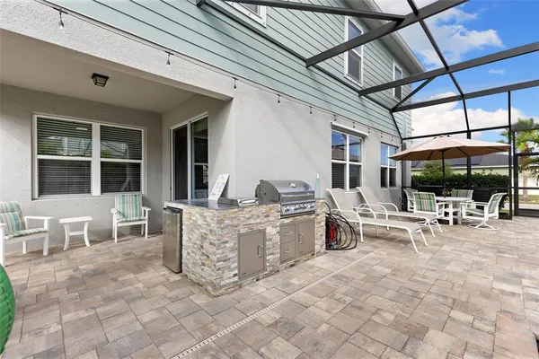 a view of swimming pool with outdoor seating