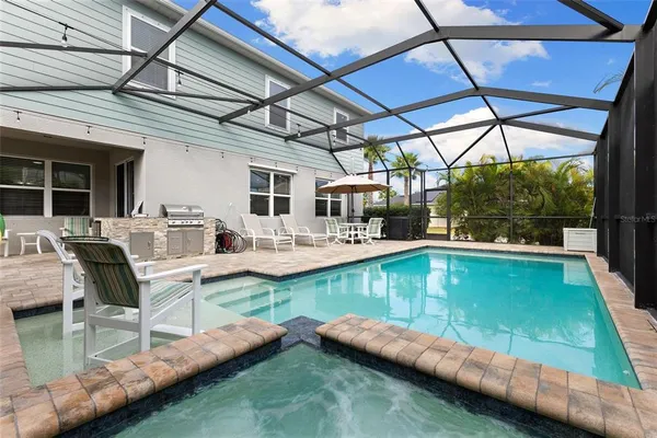 a view of a swimming pool with a patio
