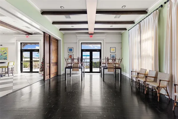 a living room with lots of furniture and a large window