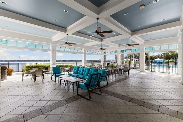 a view of swimming pool with outdoor seating