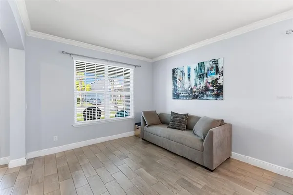 a view of a livingroom with furniture and window