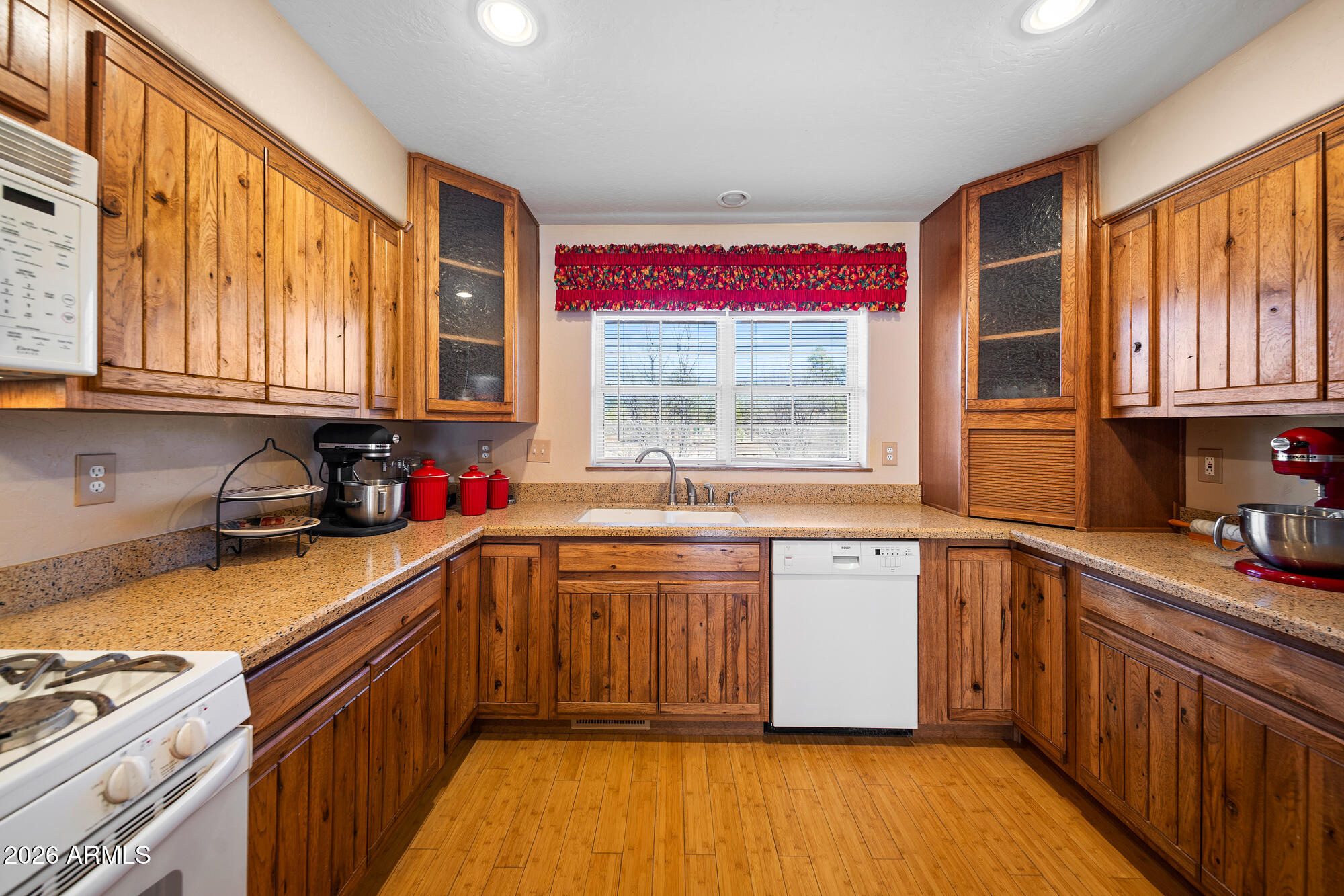 1234 Turkey Hill Road Pinedale, AZ 85934 - Photo 11 of 48 a kitchen with stainless steel appliances granite countertop wooden cabinets a window and a sink