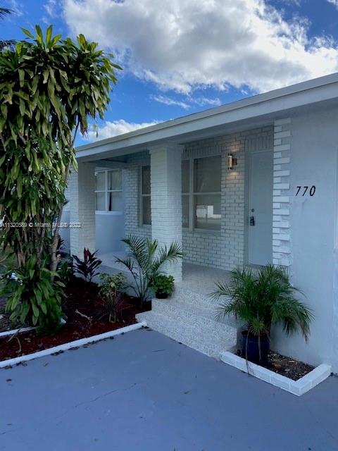 Biscayne Gardens Miami, FL 33169 - Photo 4 of 18 a potted plant in front of a house