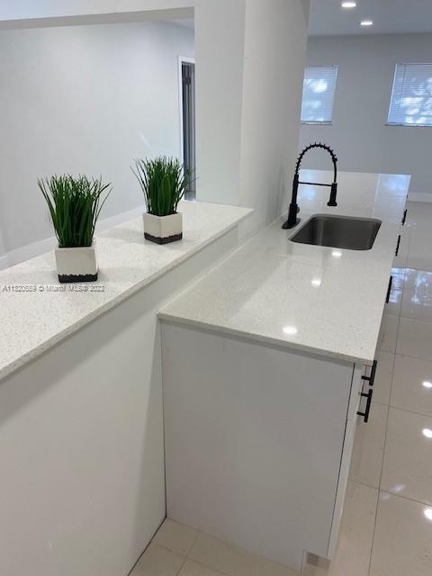 Biscayne Gardens Miami, FL 33169 - Photo 10 of 18 a close view of a sink and a potted plant on a counter