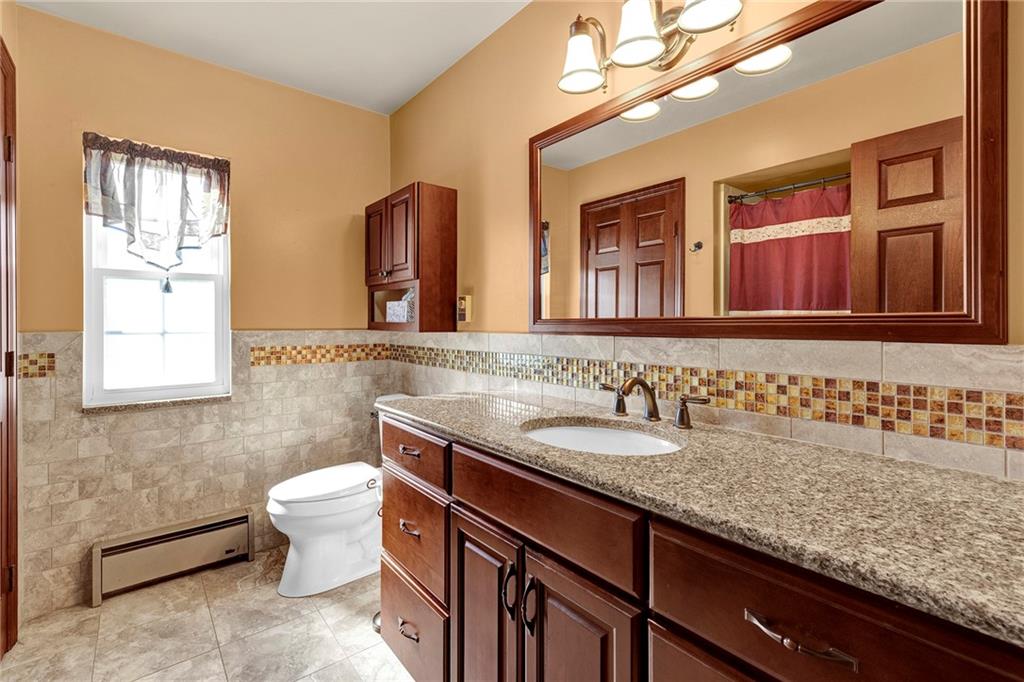 180 Swearingen Road Georgetown, PA 15043 - Photo 13 of 20 a bathroom with a granite countertop sink and a mirror