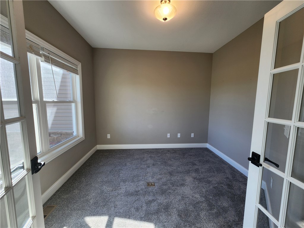 7441 Dodson Road Brookville, OH 45309 - Photo 14 of 50 This versatile room, adorned with plush carpet, offers an ideal space for an office or study.