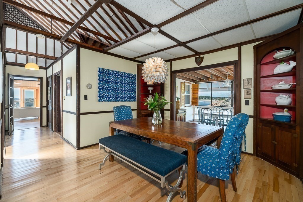 45 Salt Island Road Gloucester, MA 01930 - Photo 13 of 42 a dining room with furniture and wooden floor