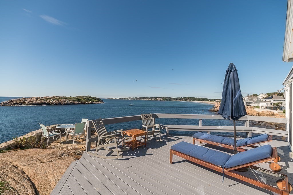 45 Salt Island Road Gloucester, MA 01930 - Photo 27 of 42 a view of a ocean with two chairs and a table