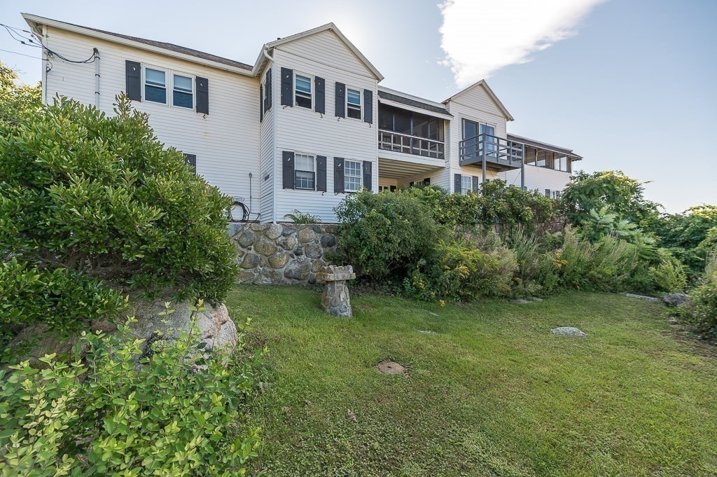 45 Salt Island Road Gloucester, MA 01930 - Photo 29 of 42 a backyard of a house with lots of green space