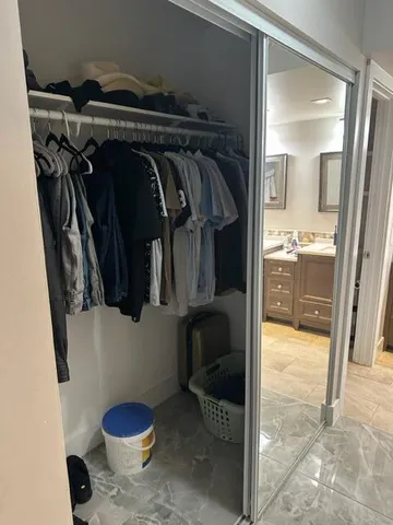 a view of a brick house with a large window