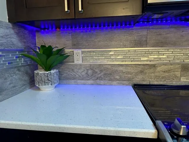 a kitchen with a table chairs and a stove