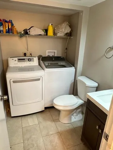 a living room with furniture a couch and a chandelier