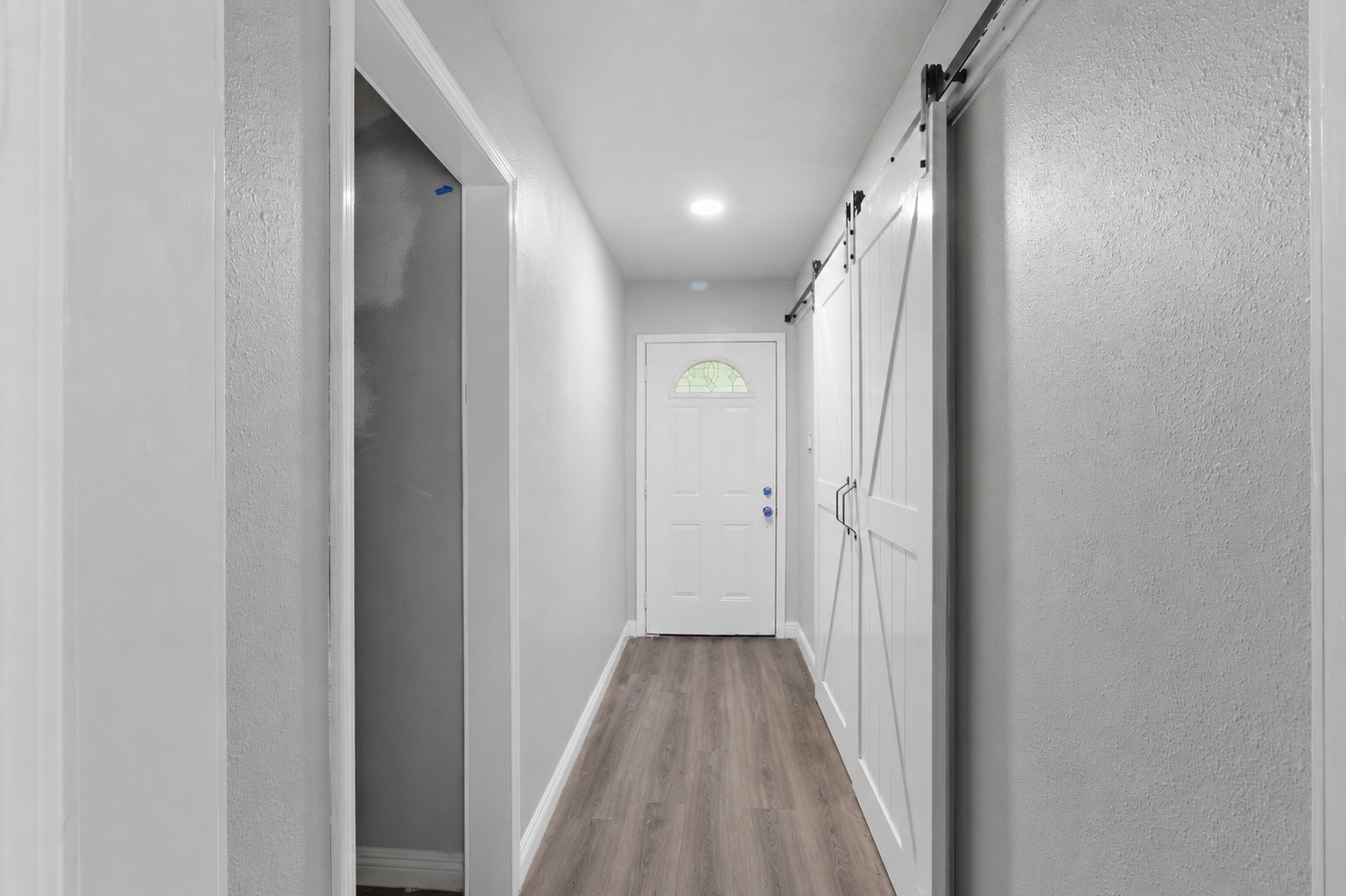 1910 Riverwood Trail Spring, TX 77386 - Photo 3 of 11 a view of a hallway with wooden floor