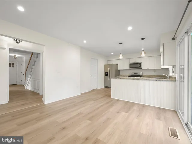 a view of kitchen with wooden floor