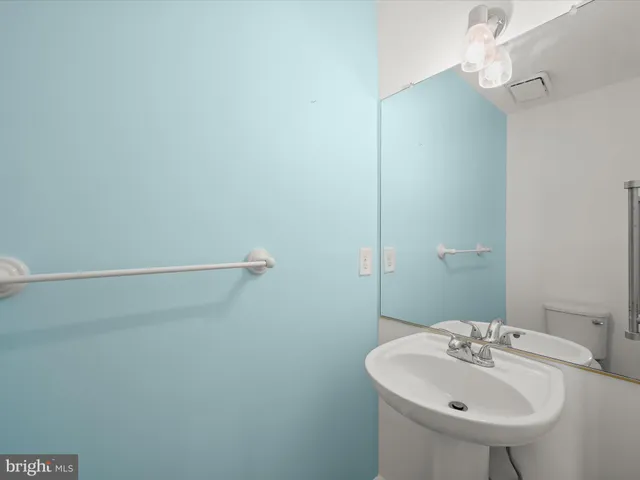 a bathroom with a sink and mirror