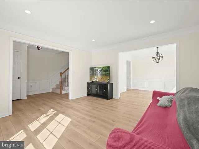 a view of a livingroom with furniture and closet
