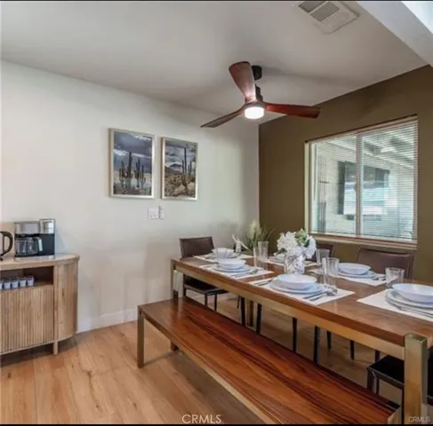 a kitchen with a table and chairs in it