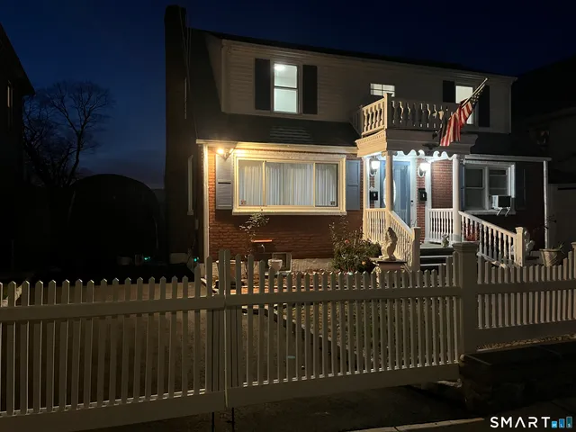 a view of a house with a iron gate