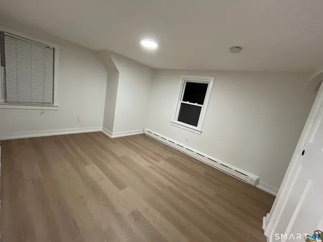 a view of a livingroom with wooden floor