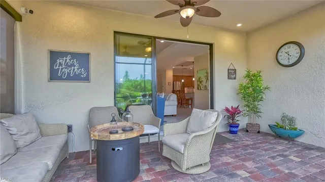 a living room with furniture and a clock
