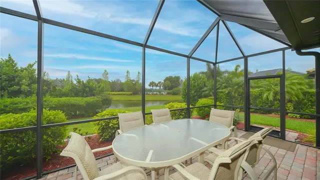 a view of a balcony with a table and chairs