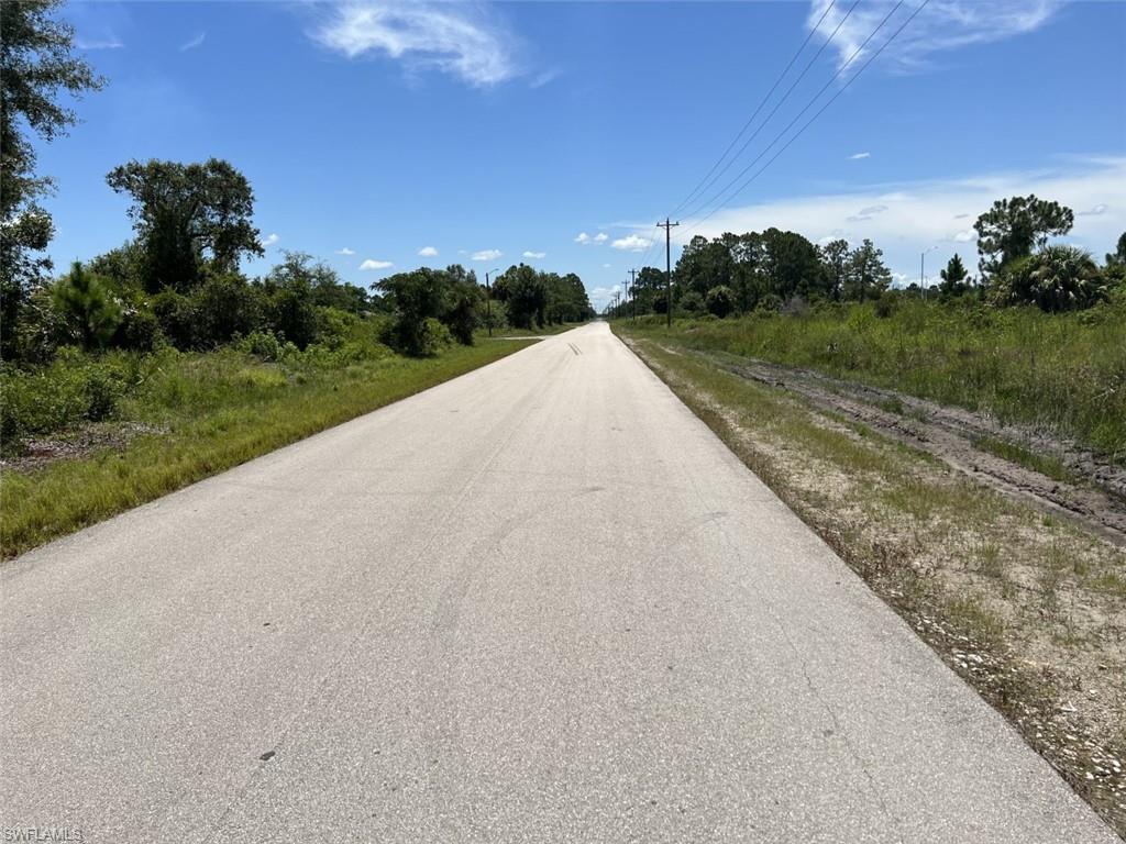 3368 Meadow Road Lehigh Acres, FL 33974 - Photo 5 of 10 View looking east from the street