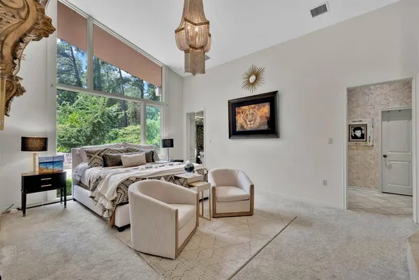 a bedroom with a bed and a couch