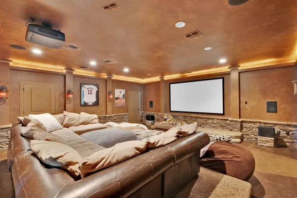 a view of a livingroom with furniture and a ceiling fan