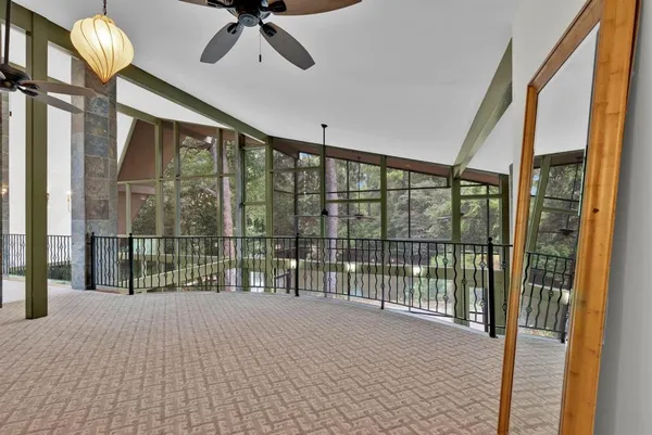 a view of balcony with furniture