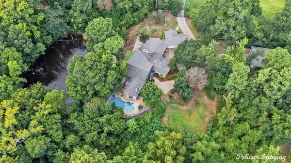 a view of a house with a tree in the background