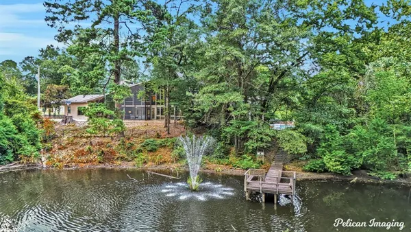 a balcony with chairs and a table