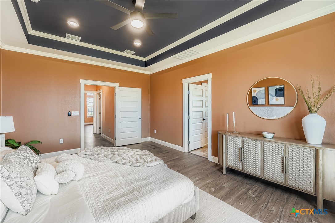 222 Arosa Drive Elgin, TX 78621 - Photo 9 of 40 a bedroom with a large bed and a dresser