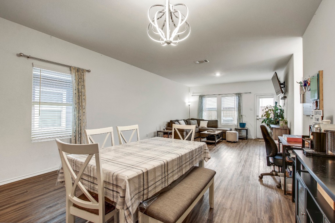 207 Soapstone Pass Maxwell, TX 78656 - Photo 11 of 30 a view of a dining room with furniture window and wooden floor