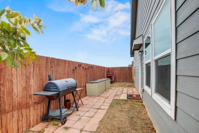 a backyard of a house with seating space
