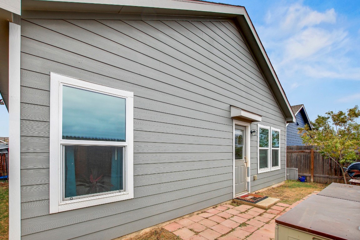 207 Soapstone Pass Maxwell, TX 78656 - Photo 30 of 30 a backyard of a house with seating space