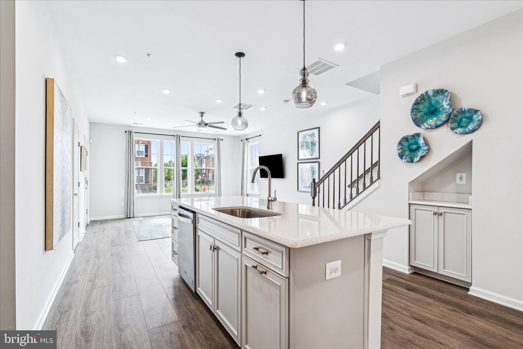 9454 James Macgowan Lane, Unit 447 Owings Mills, MD 21117 - Photo 12 of 41 a bathroom with a sink a large mirror and a shower